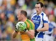 27 July 2013; Colm McFadden, Donegal, in action against Conor Meredith, Laois. GAA Football All-Ireland Senior Championship, Round 4, Donegal v Laois, Pairc Sean Mac Diarmada, Carrick-on-Shannon, Co. Leitrim. Picture credit: Oliver McVeigh / SPORTSFILE