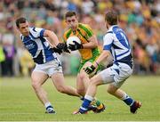 27 July 2013; Patrick McBrearty, Donegal, in action against John O'Loughlin and Mark Timmons, Laois. GAA Football All-Ireland Senior Championship, Round 4, Donegal v Laois, Pairc Sean Mac Diarmada, Carrick-on-Shannon, Co. Leitrim. Picture credit: Oliver McVeigh / SPORTSFILE