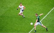 27 July 2013; Kevin Reilly, the Meath captain, shoots goalwards under pressure from Tyrone's Mark Donnelly. GAA Football All-Ireland Senior Championship, Round 4, Meath v Tyrone, Croke Park, Dublin. Picture credit: Ray McManus / SPORTSFILE