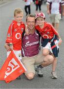 28 July 2013; Loughnane brothers Sean, age 6, left, and Ben, age 8, with their father Paddy, from Kinsale, Co. Cork, ahead of the game. GAA Hurling All-Ireland Senior Championship, Quarter-Final, Cork v Kilkenny, Semple Stadium, Thurles, Co. Tipperary. Picture credit: Stephen McCarthy / SPORTSFILE