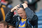 28 July 2013; A Clare supporter fixes his hood during a shower of rain. GAA Hurling All-Ireland Senior Championship, Quarter-Final, Galway v Clare, Semple Stadium, Thurles, Co. Tipperary. Picture credit: Stephen McCarthy / SPORTSFILE