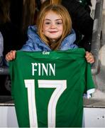 30 November 2021; Republic of Ireland supporter Isobel Byrne, age 7, with the jersey belong to Jamie Finn of Republic of Ireland following the FIFA Women's World Cup 2023 qualifying group A match between Republic of Ireland and Georgia at Tallaght Stadium in Dublin. Photo by Stephen McCarthy/Sportsfile