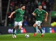 15 November 2021; Stuart Dallas, left, and Tom Flanagan of Northern Ireland during the FIFA World Cup 2022 Qualifier match between Northern Ireland and Italy at the National Football Stadium at Windsor Park in Belfast. Photo by David Fitzgerald/Sportsfile