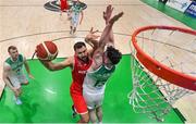 28 November 2021; Jozo Rados of Austria goes up for a basket against Jordan Blount of Ireland during the FIBA EuroBasket 2025 Pre-Qualifiers First Round Group A match between Ireland and Austria at National Basketball Arena in Tallaght, Dublin. Photo by Brendan Moran/Sportsfile