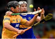 4 July 2021; David Reidy of Clare in action against Brendan Maher of Tipperary during the Munster GAA Hurling Senior Championship Semi-Final match between Tipperary and Clare at LIT Gaelic Grounds in Limerick. Photo by Ray McManus/Sportsfile