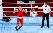 30 July 2021; Aidan Walsh of Ireland injures his ankle while being declared victorious over Merven Clair of Mauritius by referee Mansur Muhiddinov following their men's welterweight quarter-final bout at the Kokugikan Arena during the 2020 Tokyo Summer Olympic Games in Tokyo, Japan. Photo by Stephen McCarthy/Sportsfile