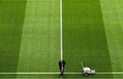 31 July 2021; Groundsman Enda Colfer places a sideline flag as he refreshes the white line before the Ulster GAA Football Senior Championship Final match between Monaghan and Tyrone at Croke Park in Dublin. Photo by Ray McManus/Sportsfile