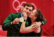 3 August 2021; Michaela Walsh of Ireland kisses her brother Aidan Walsh of Ireland with his bronze medal that he won in the men's welterweight division at the Kokugikan Arena during the 2020 Tokyo Summer Olympic Games in Tokyo, Japan. Photo by Brendan Moran/Sportsfile