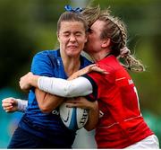 11 September 2021; Eva Sterrit of Leinster is tackled by Kate Flannery of Munster during the PwC U18 Women’s Interprovincial Championship Round 3 match between Leinster and Munster at MU Barnhall in Leixlip, Kildare. Photo by Michael P Ryan/Sportsfile