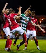 18 September 2021; Rory Gaffney of Shamrock Rovers in action against Sligo Rovers players, from left, Garry Buckley, Colm Horgan and Greg Bolger during the SSE Airtricity League Premier Division match between Sligo Rovers and Shamrock Rovers at The Showgrounds in Sligo. Photo by Stephen McCarthy/Sportsfile