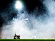 22 October 2021; Bohemians and Waterford players huddle before the Extra.ie FAI Cup Semi-Final match between Bohemians and Waterford at Dalymount Park in Dublin. Photo by Stephen McCarthy/Sportsfile