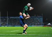 3 December 2021; Mack Hansen of Connacht catches the ball ahead of Jordan Larmour of Leinster on his way to scoring his side's first try during the United Rugby Championship match between Leinster and Connacht at the RDS Arena in Dublin. Photo by Ramsey Cardy/Sportsfile