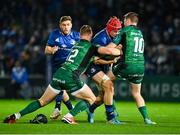 3 December 2021; Josh van der Flier of Leinster is tackled by Peter Robb, left, and Jack Carty of Connacht during the United Rugby Championship match between Leinster and Connacht at the RDS Arena in Dublin. Photo by Sam Barnes/Sportsfile