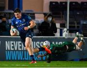 3 December 2021; Dan Sheehan of Leinster skips past the attempted tackle of Mack Hansen of Connacht on his way to scoring his side's third try during the United Rugby Championship match between Leinster and Connacht at the RDS Arena in Dublin. Photo by Brendan Moran/Sportsfile