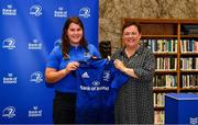 3 December 2021; Alice O'Dowd is presented with her jersey by Paula Murphy, Head of Strategic Sponsorship and Corporate & Social Responsibility at Bank of Ireland, during the Leinster Rugby Womens Cap and Jersey Presentation at the RDS Library in Dublin. Photo by Sam Barnes/Sportsfile