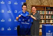 3 December 2021; Vic O'Mahony is presented with her jersey by Paula Murphy, Head of Strategic Sponsorship and Corporate & Social Responsibility at Bank of Ireland, during the Leinster Rugby Womens Cap and Jersey Presentation at the RDS Library in Dublin. Photo by Sam Barnes/Sportsfile
