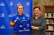 3 December 2021; Ali Coleman is presented with her jersey by Paula Murphy, Head of Strategic Sponsorship and Corporate & Social Responsibility at Bank of Ireland, during the Leinster Rugby Womens Cap and Jersey Presentation at the RDS Library in Dublin. Photo by Sam Barnes/Sportsfile