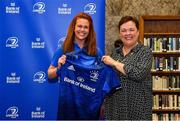 3 December 2021; Caoimhe Molloy is presented with her jersey by Paula Murphy, Head of Strategic Sponsorship and Corporate & Social Responsibility at Bank of Ireland, during the Leinster Rugby Womens Cap and Jersey Presentation at the RDS Library in Dublin. Photo by Sam Barnes/Sportsfile