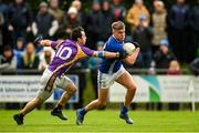 4 December 2021; Odhran Rafferty of Dromore is tackled by Eamon McHugh of Derrygonnelly Harps during the AIB Ulster GAA Football Senior Club Championship Quarter-Final match between Dromore and Derrygonnelly Harps at Páirc Colmcille in Carrickmore, Tyrone. Photo by Ramsey Cardy/Sportsfile
