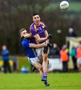 4 December 2021; Stephen McGullion of Derrygonnelly Harps is tackled by Niall Sludden of Dromore during the AIB Ulster GAA Football Senior Club Championship Quarter-Final match between Dromore and Derrygonnelly Harps at Páirc Colmcille in Carrickmore, Tyrone. Photo by Ramsey Cardy/Sportsfile