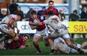 4 December 2021; David Hawkshaw of Clontarf is tackled by Giuseppe Coyne, top, and Alan Francis of Dublin University during the Energia Men’s All-Ireland League Division 1A match between Clontarf and Dublin University at Castle Avenue in Dublin. Photo by David Fitzgerald/Sportsfile