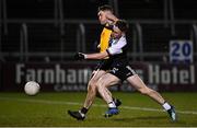 4 December 2021; Ceilum Docherty of Kilcoo in action against Eoin Somerville of Ramor United during the AIB Ulster GAA Football Senior Club Championship Quarter-Final match between Ramor United and Kilcoo at Kingspan Breffni in Cavan. Photo by Seb Daly/Sportsfile
