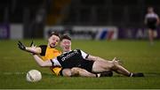 4 December 2021; Ryan McEvoy of Kilcoo is tackled by Gareth Mannion of Ramor United during the AIB Ulster GAA Football Senior Club Championship Quarter-Final match between Ramor United and Kilcoo at Kingspan Breffni in Cavan. Photo by Seb Daly/Sportsfile