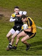 4 December 2021; Simon Cadden of Ramor United in action against Miceal Rooney of Kilcoo during the AIB Ulster GAA Football Senior Club Championship Quarter-Final match between Ramor United and Kilcoo at Kingspan Breffni in Cavan. Photo by Seb Daly/Sportsfile