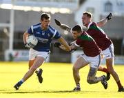 5 December 2021; John Heslin of St Loman's in action against Stuart Mulpeter and Adam Ryan of Portarlington during the AIB Leinster GAA Football Senior Club Championship Quarter-Final match between Portarlington and St Loman's at MW Hire O’Moore Park in Portlaoise, Laois. Photo by Matt Browne/Sportsfile