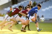 5 December 2021; TJ Cox of St Loman's in action against David Murphy and Rioghan Murphy of Portarlington during the AIB Leinster GAA Football Senior Club Championship Quarter-Final match between Portarlington and St Loman's at MW Hire O’Moore Park in Portlaoise, Laois. Photo by Matt Browne/Sportsfile