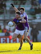 5 December 2021; Thomas O’Reilly of Wolfe Tones is tackled by Aidan Jones of Kilmacud Crokes during the AIB Leinster GAA Football Senior Club Championship Quarter-Final match between Wolfe Tones and Kilmacud Crokes at Páirc Tailteann in Navan, Meath. Photo by Ray McManus/Sportsfile