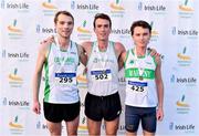 5 December 2021; Novice Men's 6000m medallists, Liam Harris of Togher AC, Cork, centre, gold, Jamie Fallon of Craughwell AC, Galway, left, silver, and Daniel Stone of Raheny Shamrock AC, Dublin, right, bronze, during the Irish Life Health National Novice, Junior, and Juvenile Uneven Age Cross Country Championships at Gowran Park in Kilkenny. Photo by Sam Barnes/Sportsfile
