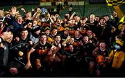 5 December 2021; Austin Stacks players and supporters celebrate with the Bishop Moynihan Cup after the Kerry County Senior Football Championship Final match between Austin Stacks and Kerins O'Rahilly's at Austin Stack Park in Tralee, Kerry. Photo by Brendan Moran/Sportsfile