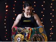 8 December 2021; Katie Taylor poses for a portrait with her belts during a media day ahead of her Undisputed Lightweight Championship bout against Firuza Sharipova at the Liverpool Guild of Students in Liverpool, England. Photo by Mark Robinson / Matchroom Boxing via Sportsfile
