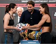 10 December 2021; Katie Taylor, left, is presented with a football by Firuza Sharipova during weigh ins ahead of their Undisputed Lightweight Championship bout at The Black-E in Liverpool, England. Photo by Stephen McCarthy/Sportsfile