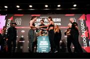 10 December 2021; Katie Taylor, left, is presented with a football by Firuza Sharipova during weigh ins ahead of their Undisputed Lightweight Championship bout at The Black-E in Liverpool, England. Photo by Stephen McCarthy/Sportsfile