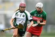 11 December 2021; Orlaith McGrath of Sarsfields in action against Mairéad Eviston of Drom and Inch during the 2020 AIB All-Ireland Senior Club Camogie Championship Semi-Final match between Sarsfields and Drom and Inch at Edenderry GAA club in Edenderry, Offaly. Photo by Piaras Ó Mídheach/Sportsfile