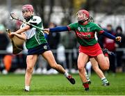 11 December 2021; Orlaith McGrath of Sarsfields in action against Aoife McGrath of Drom and Inch during the 2020 AIB All-Ireland Senior Club Camogie Championship Semi-Final match between Sarsfields and Drom and Inch at Edenderry GAA club in Edenderry, Offaly. Photo by Piaras Ó Mídheach/Sportsfile