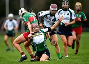 11 December 2021; Orlaith McGrath of Sarsfields in action against Niamh Treacy of Drom and Inch during the 2020 AIB All-Ireland Senior Club Camogie Championship Semi-Final match between Sarsfields and Drom and Inch at Edenderry GAA club in Edenderry, Offaly. Photo by Piaras Ó Mídheach/Sportsfile
