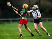 11 December 2021; Mary Burke of Drom and Inch in action against Clodagh McGrath of Sarsfields during the 2020 AIB All-Ireland Senior Club Camogie Championship Semi-Final match between Sarsfields and Drom and Inch at Edenderry GAA club in Edenderry, Offaly. Photo by Piaras Ó Mídheach/Sportsfile