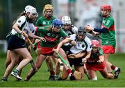11 December 2021; Niamh McGrath of Sarsfields is tackled by Éimear McGrath, 11, and Aoife McGrath of Drom and Inch during the 2020 AIB All-Ireland Senior Club Camogie Championship Semi-Final match between Sarsfields and Drom and Inch at Edenderry GAA club in Edenderry, Offaly. Photo by Piaras Ó Mídheach/Sportsfile