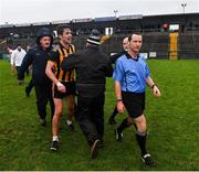 11 December 2021; Michael Daly of Mountbellew/Moylough attempts to confront referee Jerome Henry as he is escorted off the filed after the AIB Connacht GAA Football Senior Club Championship Semi-Final match between Pádraig Pearses and Mountbellew/Moylough at Dr Hyde Park in Roscommon. Photo by Eóin Noonan/Sportsfile