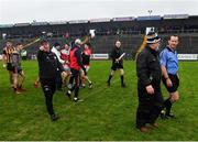 11 December 2021; Referee Jerome Henry is escorted off the field after the AIB Connacht GAA Football Senior Club Championship Semi-Final match between Pádraig Pearses and Mountbellew/Moylough at Dr Hyde Park in Roscommon. Photo by Eóin Noonan/Sportsfile