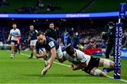 11 December 2021; Jamison Gibson-Park of Leinster scores his side's first try despite the tackle of Josh Bayliss of Bath during the Heineken Champions Cup Pool A match between Leinster and Bath at Aviva Stadium in Dublin. Photo by Brendan Moran/Sportsfile