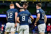 11 December 2021; Jamison Gibson-Park of Leinster is congratulated by teammates, from left, Ciarán Frawley, Ross Byrne and Garry Ringrose after scoring their side's first try during the Heineken Champions Cup Pool A match between Leinster and Bath at Aviva Stadium in Dublin. Photo by Brendan Moran/Sportsfile