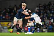 11 December 2021; Andrew Porter of Leinster is tackled by Richard De Carpentier of Bath during the Heineken Champions Cup Pool A match between Leinster and Bath at Aviva Stadium in Dublin. Photo by Ramsey Cardy/Sportsfile