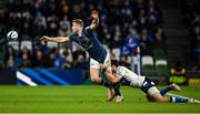 11 December 2021; Jordan Larmour of Leinster is tackled by Will Muir of Bath during the Heineken Champions Cup Pool A match between Leinster and Bath at Aviva Stadium in Dublin. Photo by Brendan Moran/Sportsfile