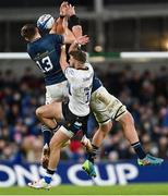 11 December 2021; Tom De Glanville of Bath in action against Garry Ringrose, 13, and Rhys Ruddock of Leinster during the Heineken Champions Cup Pool A match between Leinster and Bath at Aviva Stadium in Dublin. Photo by Ramsey Cardy/Sportsfile