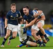 11 December 2021; James Lowe of Leinster is tackled by Will Muir, left, and Tom Ellis of Bath during the Heineken Champions Cup Pool A match between Leinster and Bath at Aviva Stadium in Dublin. Photo by Ramsey Cardy/Sportsfile