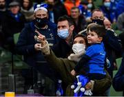 11 December 2021; Rebecca McFadden shows son Freddie highlights of his father Fergus McFadden on the big screen before the Heineken Champions Cup Pool A match between Leinster and Bath at Aviva Stadium in Dublin. Photo by Harry Murphy/Sportsfile